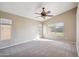 Spacious main bedroom with ceiling fan and large windows providing natural light at 9422 W Monroe St, Peoria, AZ 85345