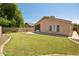 Spacious backyard featuring lush green lawn and a concrete patio, great for relaxation and recreation at 1156 N San Benito Dr, Gilbert, AZ 85234