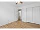 The bedroom features wood floors, closet doors, a ceiling fan, and access to a full bathroom at 1156 N San Benito Dr, Gilbert, AZ 85234