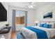 Charming bedroom with a ceiling fan, soft lighting, and backyard view at 1156 N San Benito Dr, Gilbert, AZ 85234