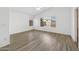 Bedroom with neutral walls, ceiling fan, and two windows with backyard views at 1156 N San Benito Dr, Gilbert, AZ 85234