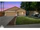 Charming single-story home with a well-maintained lawn, two car garage and inviting curb appeal at 1156 N San Benito Dr, Gilbert, AZ 85234