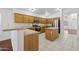 Functional kitchen featuring plenty of cabinet space, an island, stainless appliances and updated countertops at 1156 N San Benito Dr, Gilbert, AZ 85234