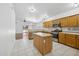 Bright kitchen featuring stainless steel appliances, an island, and ample cabinet space at 1156 N San Benito Dr, Gilbert, AZ 85234
