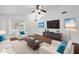 Comfortable living room with white furnishings, a ceiling fan and hardwood floors at 1156 N San Benito Dr, Gilbert, AZ 85234