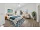 Vaulted bedroom features a ceiling fan, light wood floors, and backyard views at 1156 N San Benito Dr, Gilbert, AZ 85234