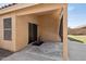 Covered patio with sliding glass door access to the house, neutral walls, and decorative rug at 1156 N San Benito Dr, Gilbert, AZ 85234