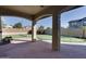 Outdoor patio area featuring a putting green and covered space at 13687 N 151St Ln, Surprise, AZ 85379