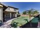 Backyard featuring a putting green and lush landscaping at 13687 N 151St Ln, Surprise, AZ 85379