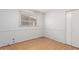 Bedroom with wood floors, a window with blinds and a closet at 1509 E Verlea Dr, Tempe, AZ 85282