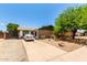 Well-kept home featuring desert landscaping, a clean driveway, and mature trees at 1509 E Verlea Dr, Tempe, AZ 85282