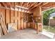 Garage with storage, workshop area, pegboard, and access to the backyard at 1509 E Verlea Dr, Tempe, AZ 85282
