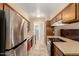 Functional kitchen with stainless steel appliances, ample cabinets, and tile flooring at 1509 E Verlea Dr, Tempe, AZ 85282