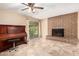 Cozy living room featuring tile floors, a brick fireplace, and a sliding glass door to the patio at 1509 E Verlea Dr, Tempe, AZ 85282