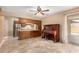 Open concept living area with tile floors seamlessly connecting the living room and kitchen at 1509 E Verlea Dr, Tempe, AZ 85282