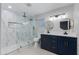 Contemporary bathroom featuring a glass-enclosed shower and dual vanity sinks at 1530 W Glenrosa Ave, Phoenix, AZ 85015
