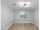 Bright bedroom with natural light, wood floors and neutral paint at 1530 W Glenrosa Ave, Phoenix, AZ 85015
