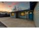 Charming home featuring a blue door, covered entry, and neutral siding at 1530 W Glenrosa Ave, Phoenix, AZ 85015
