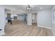 Open-concept living space with modern kitchen and light wood flooring at 1530 W Glenrosa Ave, Phoenix, AZ 85015
