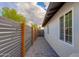 Side yard of home with modern horizontal fence and gravel at 1530 W Glenrosa Ave, Phoenix, AZ 85015
