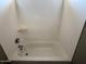 An alcove tub in a bathroom with neutral tones and a basic shower head at 15334 W Acapulco Ln, Surprise, AZ 85379