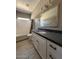 A bathroom vanity featuring a modern sink, black hardware, and tile flooring at 15334 W Acapulco Ln, Surprise, AZ 85379