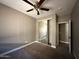 Bedroom featuring light gray walls, carpet floors, and closet at 15334 W Acapulco Ln, Surprise, AZ 85379