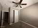 Bedroom featuring light gray walls, carpet floors, and closet at 15334 W Acapulco Ln, Surprise, AZ 85379