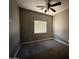 Bedroom featuring light gray walls, carpet floors, and a ceiling fan at 15334 W Acapulco Ln, Surprise, AZ 85379