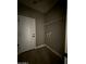 Small laundry room with wooden floors, gray walls, and a door at 15334 W Acapulco Ln, Surprise, AZ 85379