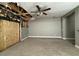 Spacious living room featuring light gray walls, tile floors, and a ceiling fan at 15334 W Acapulco Ln, Surprise, AZ 85379