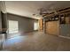 Spacious living room featuring light gray walls, tile floors, and a ceiling fan at 15334 W Acapulco Ln, Surprise, AZ 85379