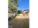 This backyard features a block fence, lawn, and desert landscaping at 16176 W Lisbon Ln, Surprise, AZ 85379