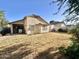 This backyard has a covered patio, lawn and desert landscaping at 16176 W Lisbon Ln, Surprise, AZ 85379