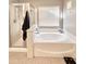 Bathroom featuring bathtub and a glass shower enclosure at 16176 W Lisbon Ln, Surprise, AZ 85379