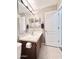 Bathroom featuring single sink vanity with decorative mirror and fixtures at 16176 W Lisbon Ln, Surprise, AZ 85379