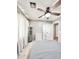Bedroom featuring a ceiling fan, a dresser, neutral carpet, and natural light at 16176 W Lisbon Ln, Surprise, AZ 85379
