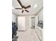 Bright bedroom with carpeted floors featuring ceiling fan and lots of natural light at 16176 W Lisbon Ln, Surprise, AZ 85379