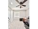 Bedroom with ceiling fan, carpet floors, and window bringing in natural light at 16176 W Lisbon Ln, Surprise, AZ 85379