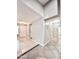 Bright entryway with tile flooring and a view into the adjacent rooms at 16176 W Lisbon Ln, Surprise, AZ 85379