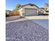 Charming single-story home with a two-car garage and low maintenance desert landscaping at 16176 W Lisbon Ln, Surprise, AZ 85379