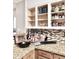 Kitchen countertop featuring granite counters, mosaic backsplash and ample storage at 16176 W Lisbon Ln, Surprise, AZ 85379