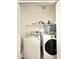 Laundry room equipped with modern washer, dryer, shelf, and storage space at 16176 W Lisbon Ln, Surprise, AZ 85379