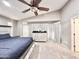 Main bedroom featuring a ceiling fan, carpet flooring, and natural lighting at 16176 W Lisbon Ln, Surprise, AZ 85379
