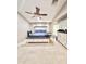 Main bedroom featuring a ceiling fan, neutral carpet, and natural light at 16176 W Lisbon Ln, Surprise, AZ 85379