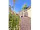 This side yard has a storage shed with desert landscaping at 16176 W Lisbon Ln, Surprise, AZ 85379
