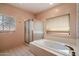 Tranquil bathroom featuring a bathtub with jets, a shower, and natural light at 16927 E Trojan Ct, Fountain Hills, AZ 85268