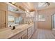 Bright bathroom with double vanity, bathtub, walk-in shower and glass block window at 16927 E Trojan Ct, Fountain Hills, AZ 85268