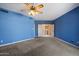 Spacious primary bedroom featuring neutral carpeting and open doorway at 16927 E Trojan Ct, Fountain Hills, AZ 85268