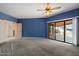 Cozy bedroom with neutral carpeting, and sliding door access to outdoor living at 16927 E Trojan Ct, Fountain Hills, AZ 85268